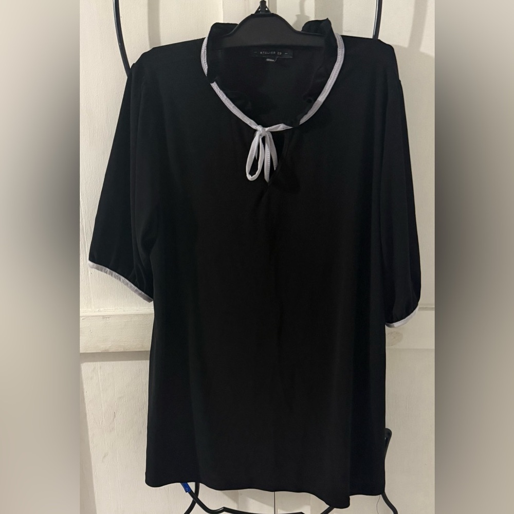 Chic Black Women's Top with White Trim